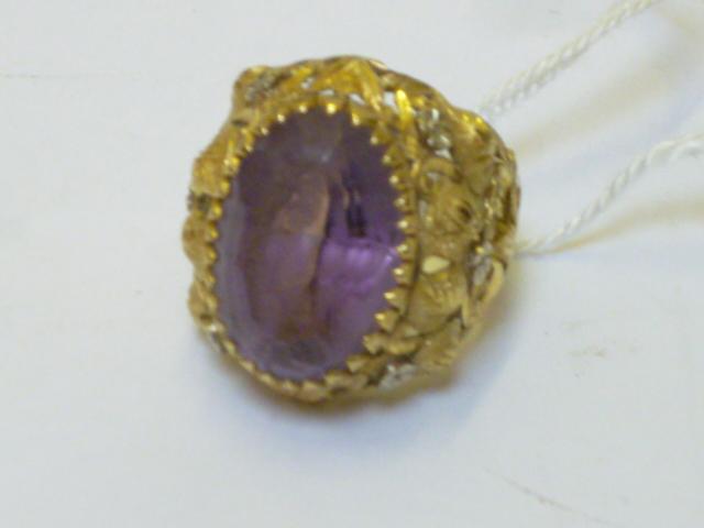 Appraisal: AN AMETHYST DRESS RING the large oval cut amethyst claw