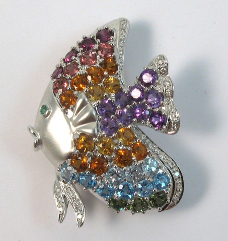 Appraisal: EIGHTEEN KARAT GOLD FISH BROOCH covered with round-cut gemstones including