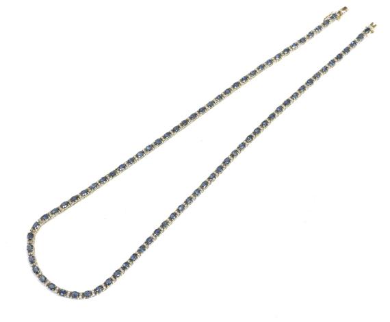 Appraisal: A SAPPHIRE AND DIAMOND NECKLACE Yellow and white gold Attractive