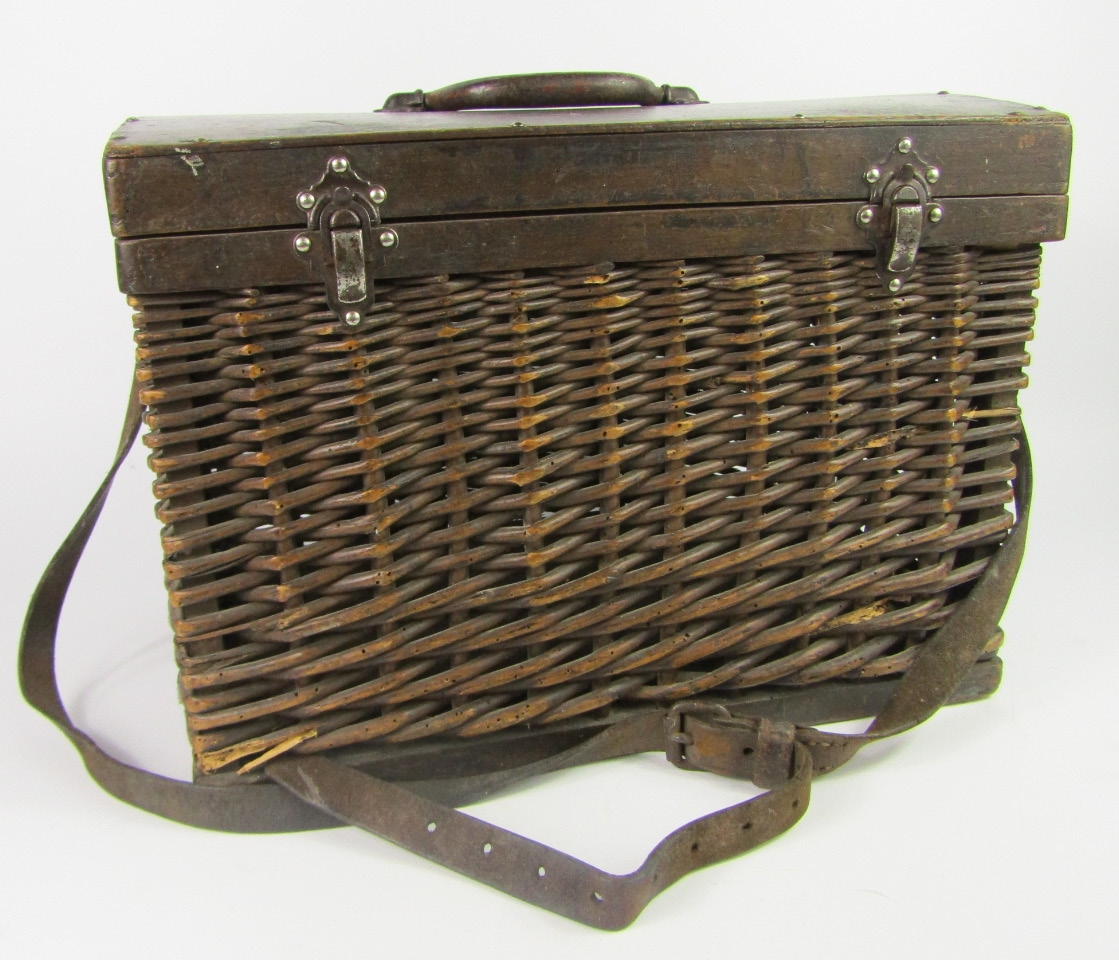 Appraisal: A wooden bound wicker fishing box with metal handle and