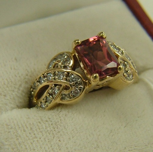 Appraisal: PINK TOURMALINE AND DIAMOND RING K yellow gold set with