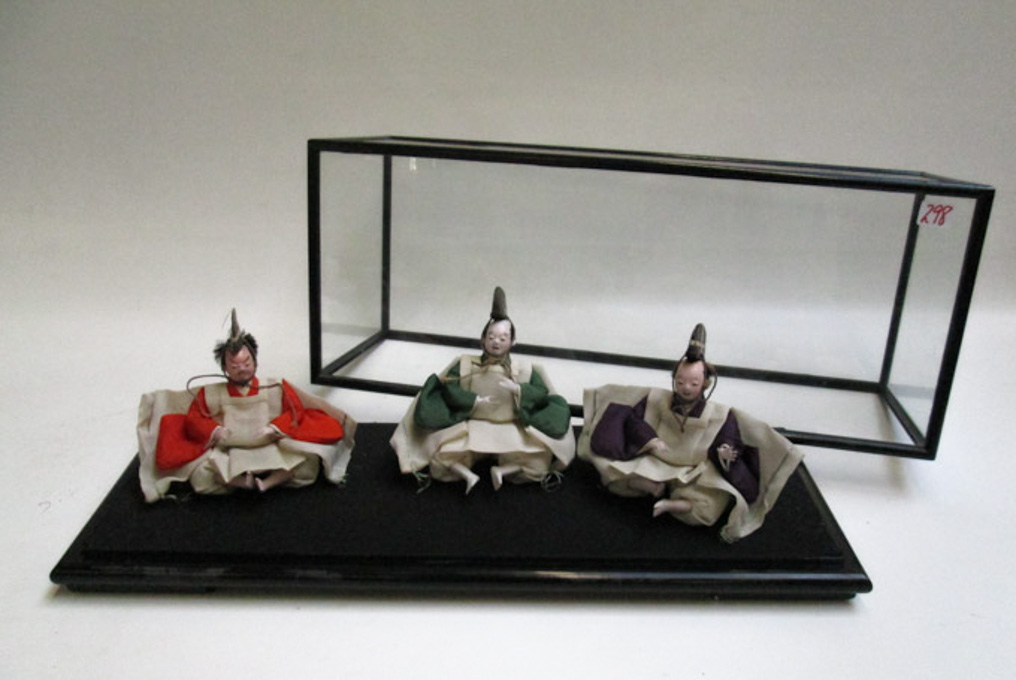 Appraisal: CASED SET OF THREE JAPANESE DOLLS three seated male figures