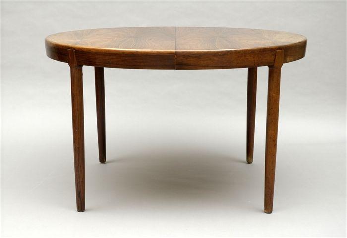 Appraisal: Ib Kofod-Larsen Rosewood Dining Table With two leaves in in