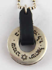 Appraisal: A white metal tests silver pendant with Hebrew inscription approx