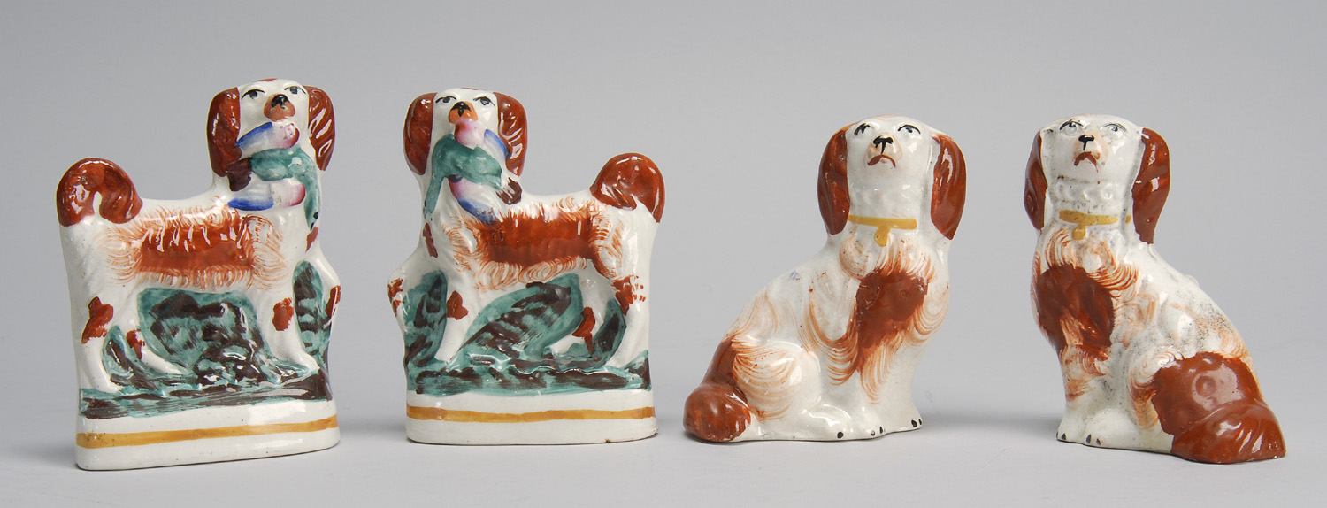 Appraisal: TWO PAIRS OF TH CENTURY ENGLISH STAFFORDSHIRE SPANIELS Both in