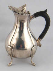 Appraisal: A silver milk jug with hinged lid Carrington Co London