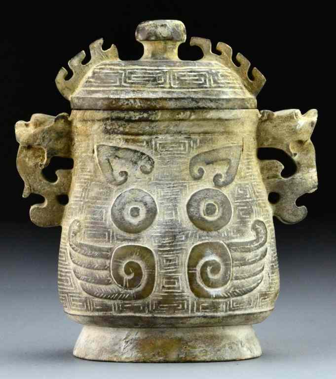 Appraisal: Chinese Archaic Style Hardstone Covered UrnFinely carved to depict the