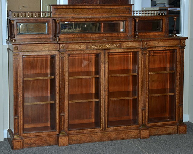 Appraisal: A VICTORIAN WALNUT AND GILT METAL CREDENZA having a raised