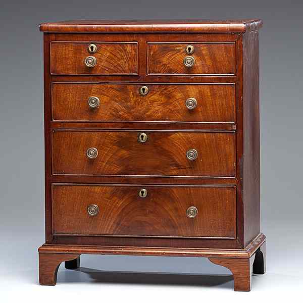 Appraisal: Miniature Chest of Drawers English early th century a miniature