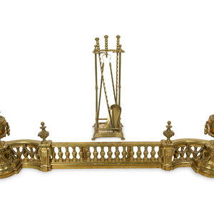 Appraisal: A Neoclassical Brass Fire Fender with a Set of Tools