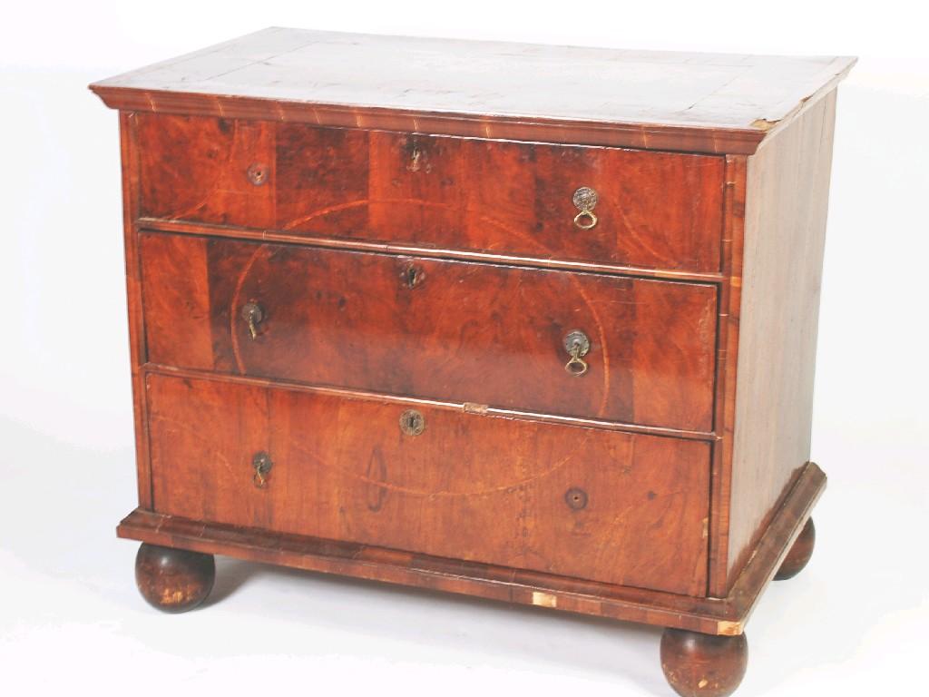 Appraisal: AN EARLY EIGHTEENTH CENTURY WALNUT CHEST OF THREE LONG DRAWERS