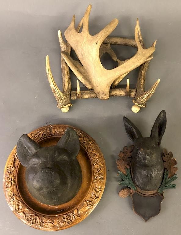 Appraisal: Animal Carvings and Horn Rack Carved pig mounted on a