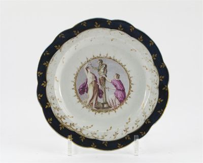 Appraisal: A Caughley plate with scalloped rim the well painted with