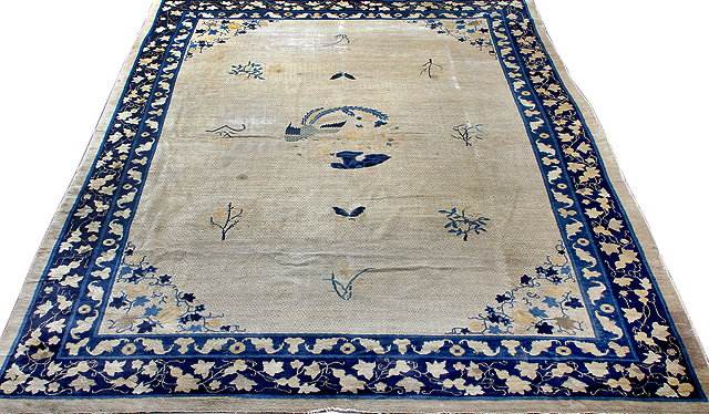 Appraisal: AN ANTIQUE CHINESE BLUE AND PALE CAMEL GROUND CARPET the