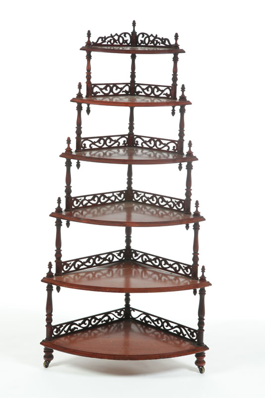 Appraisal: WHAT-NOT-SHELF Six tiered walnut shelf with openwork galleries and turned