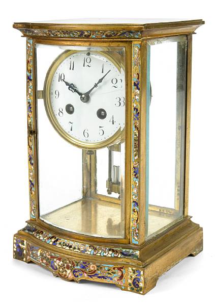 Appraisal: A French brass and champleve four glass mantel clock height