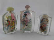 Appraisal: Three Chinese internally painted glass snuff bottles one without stopper