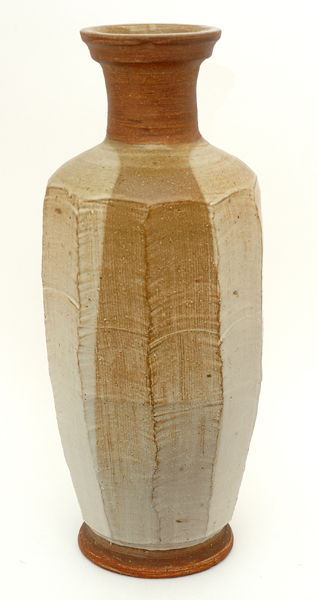 Appraisal: HAROLD HUGHAN Victoria circa Facetted cylindrical stoneware vase tan and