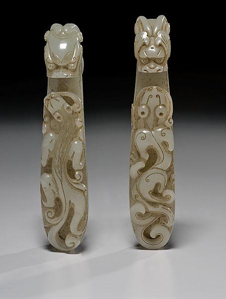 Appraisal: TWO JADE GARMENT HOOKS early th century in the style