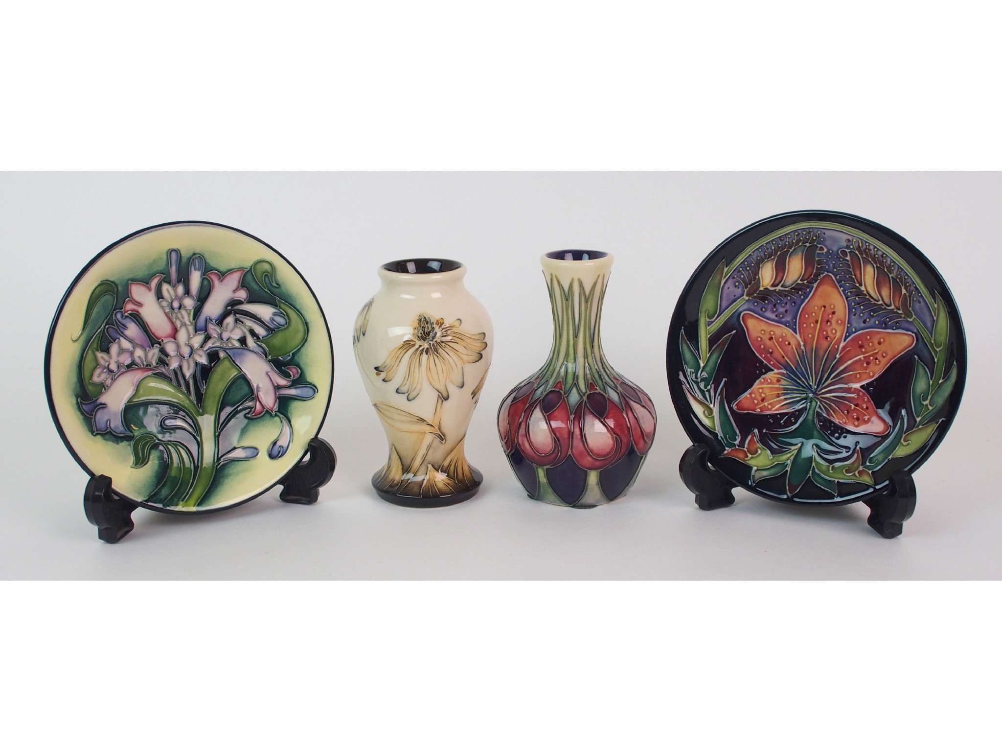 Appraisal: A Moorcroft Pottery Coneflower trial cabinet vase April Tulip cabinet