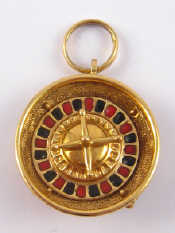 Appraisal: An unusual carat gold pendant one side set with gemstones