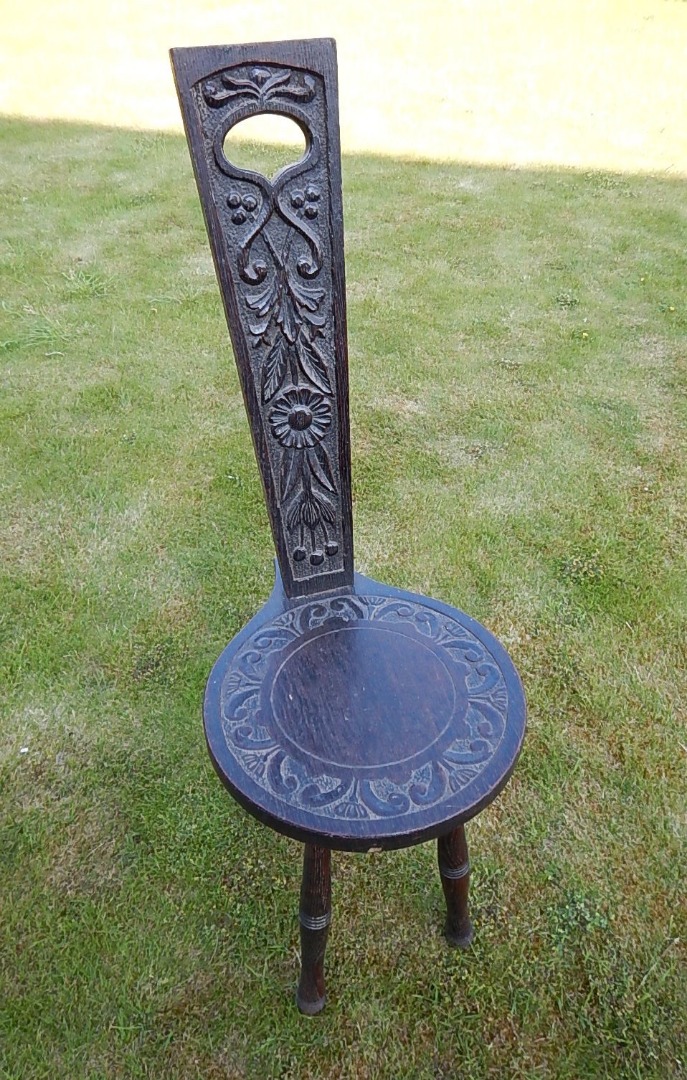 Appraisal: A spinning chair with foliate scroll and flower head decoration