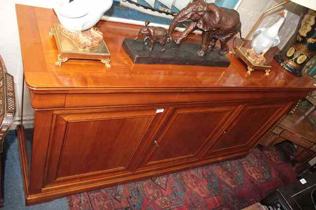 Appraisal: A CONTINENTAL MAPLE WOOD SIDE CABINET with three moulded frieze