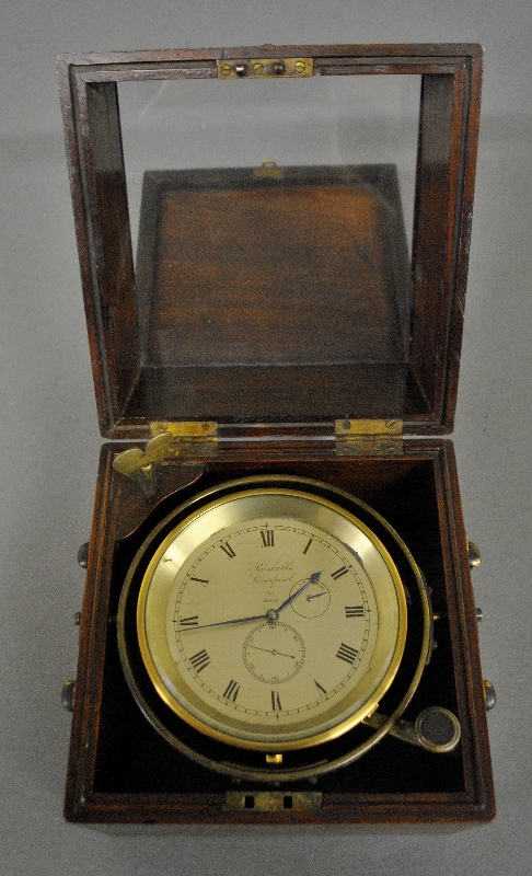 Appraisal: - Chronometer signed Roskells Liverpool in a brass bound mahogany