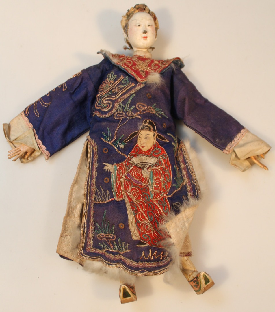 Appraisal: A thC Chinese doll with removable papier mache head and