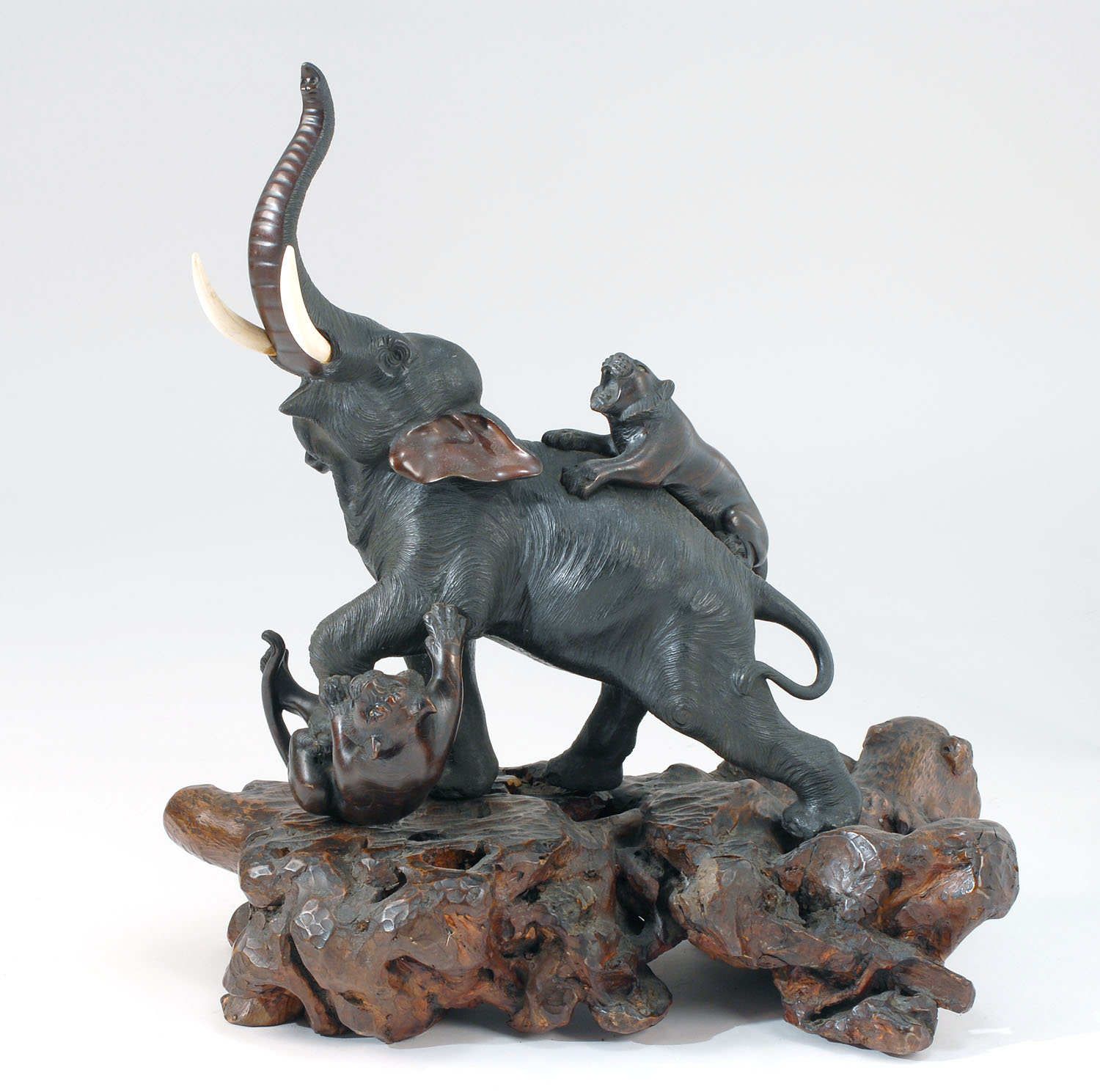 Appraisal: BRONZE FIGURE OF AN ELEPHANT Meiji PeriodBeing attacked by two