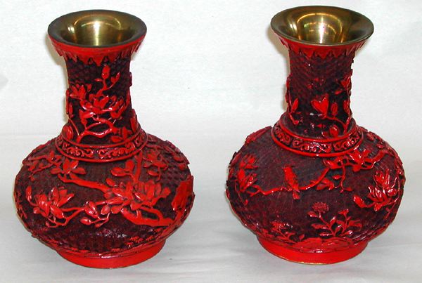 Appraisal: Pair of Chinese Elaborately Carved Cinnabar Long-Neck Vases in the