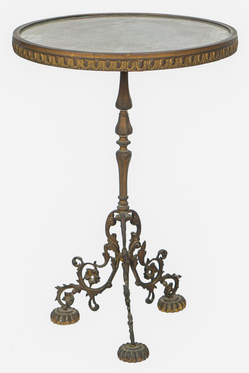 Appraisal: FRENCH GILT METAL STANDthe circular top inset with a glass