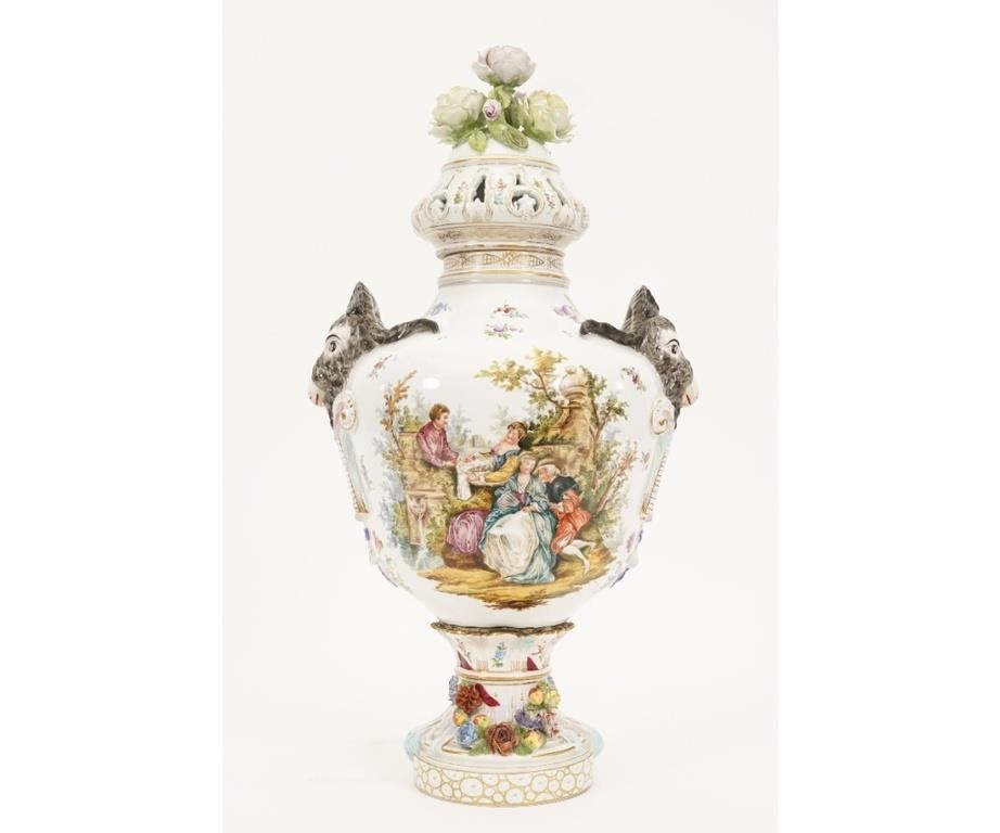 Appraisal: Large Italian porcelain covered urn with rams head masks and