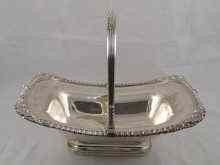 Appraisal: An Old Sheffield Plate cake basket with swing handle and