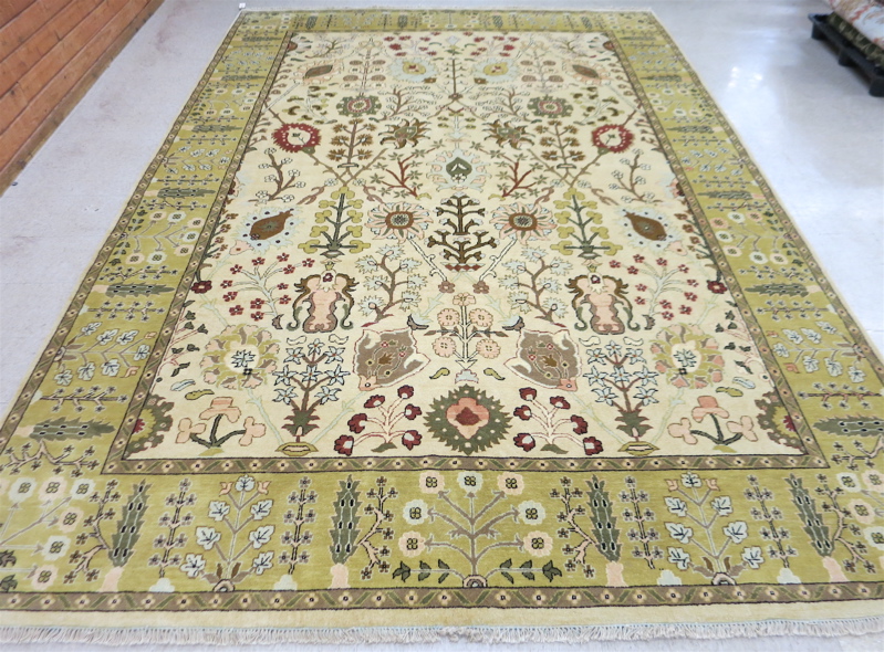 Appraisal: HAND KNOTTED ORIENTAL CARPET Indo-Persian overall foliate design on khaki