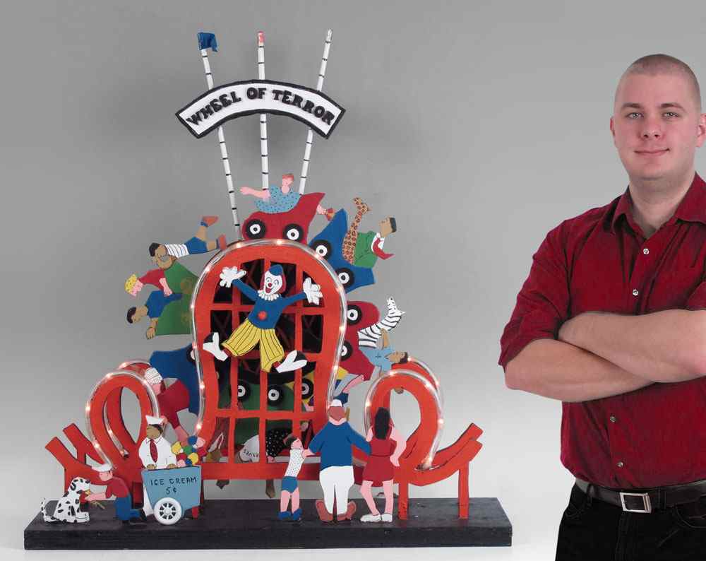 Appraisal: ILLUMINATED FOLK ART ''WHEEL OF TERROR'' SCULPTURE Created by Irving