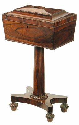 Appraisal: A George IV rosewood teapoy of sarcophagus form with reel