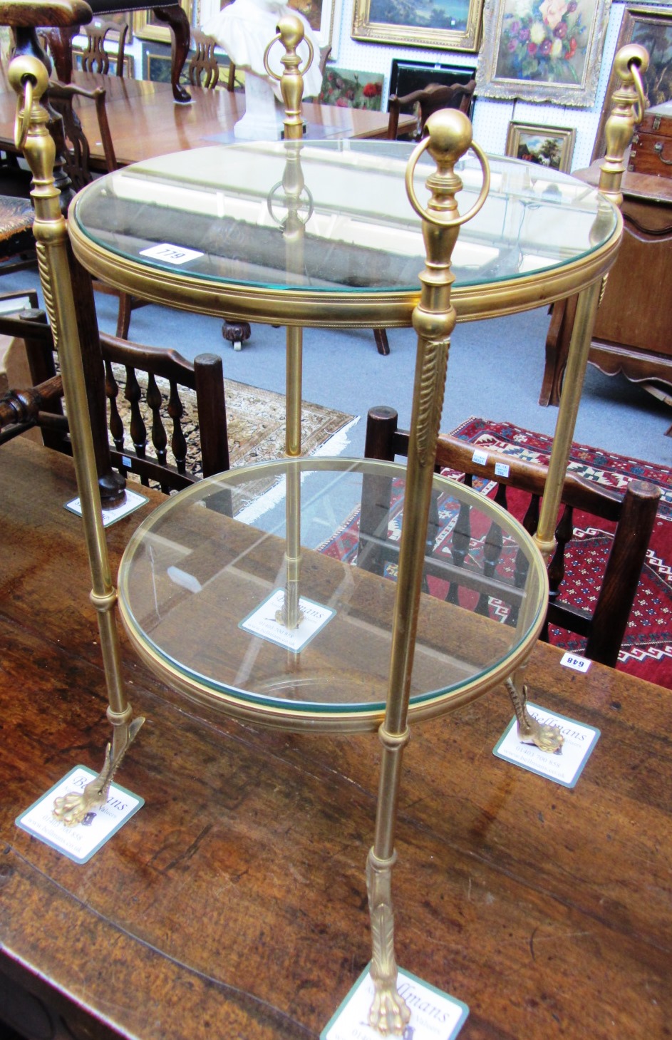 Appraisal: A th century ormolu and glass circular two tier etagere