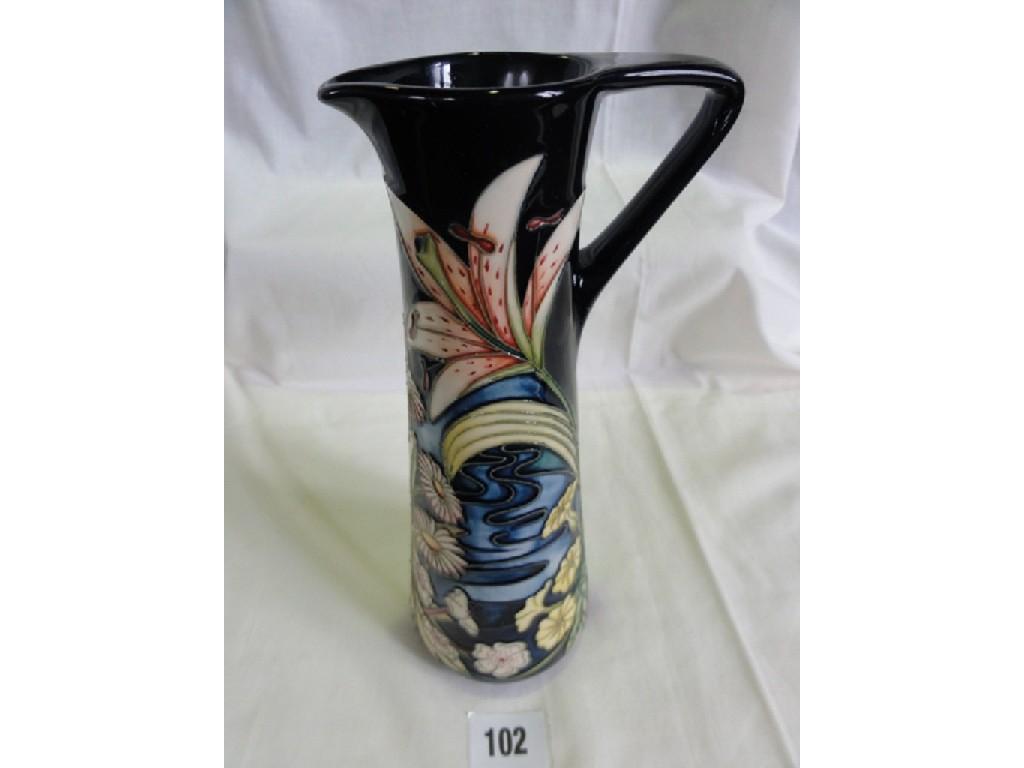 Appraisal: A Moorcroft Pottery ewer of slender tapering form with stylised