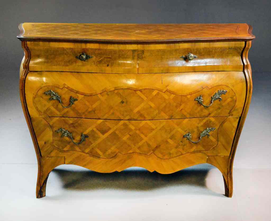 Appraisal: A Dutch Marquetry Bomb ChestBow-front chest with brass leaf pulls