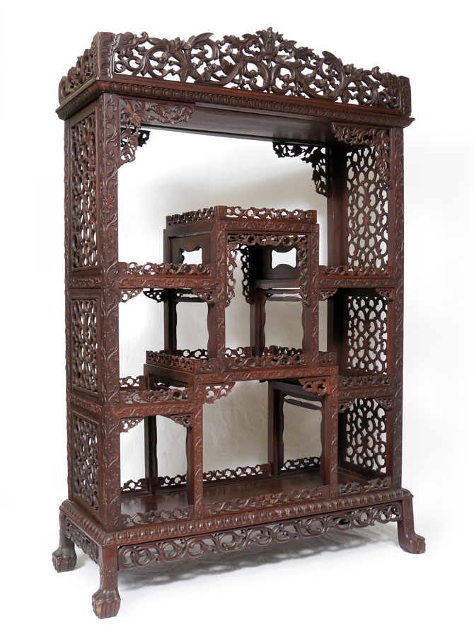 Appraisal: CARVED ORIENTAL ROSEWOOD ETAGERE Pierced and carved open display cabinet