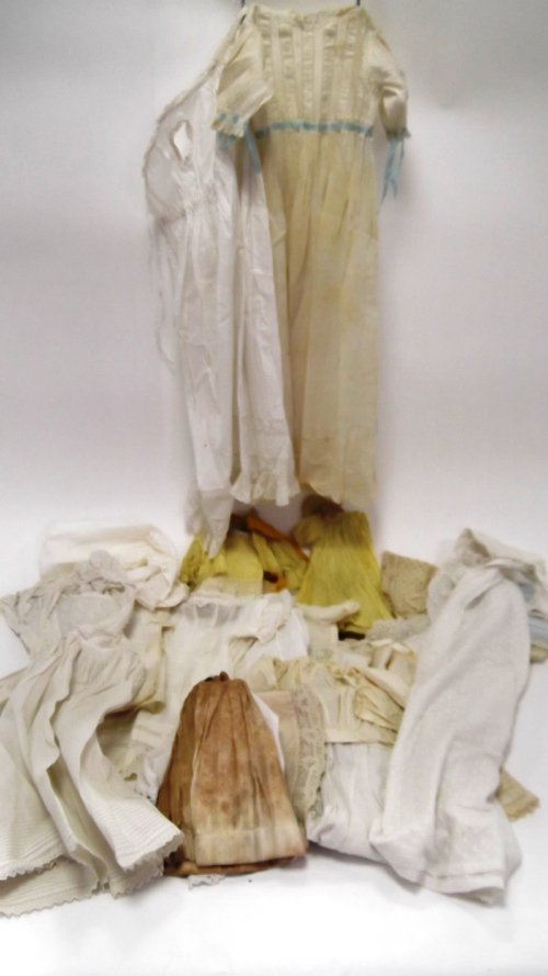 Appraisal: A doll's yellow pleated dress a yellow lace edge dress