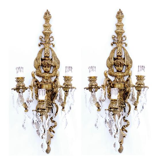 Appraisal: Pair gilt-metal and crystal three-light wall sconces Classical backplate issuing