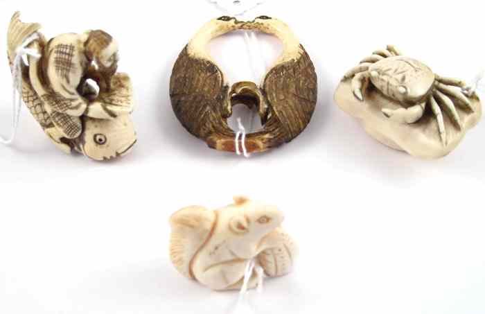 Appraisal: FOUR HAND CARVED IVORY CARVINGS Three are netsuke man astride