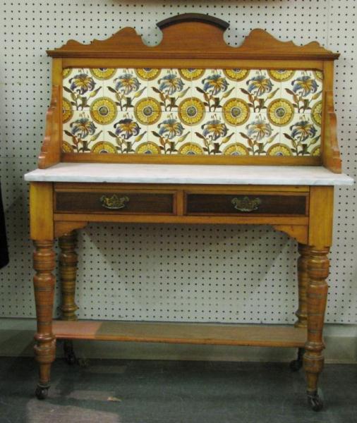 Appraisal: Antique English country-style washstand with floral motif tile back white