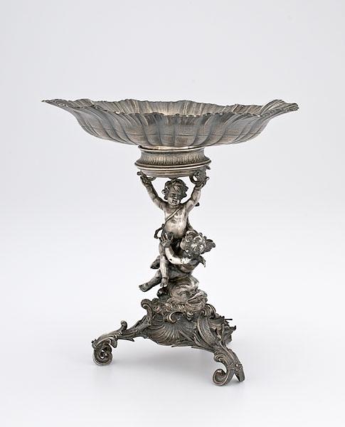 Appraisal: SILVERPLATE CENTERPIECE WITH CHERUBS probably American late th century A