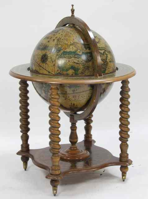 Appraisal: A cocktail cabinet of globe form on barley twist legs