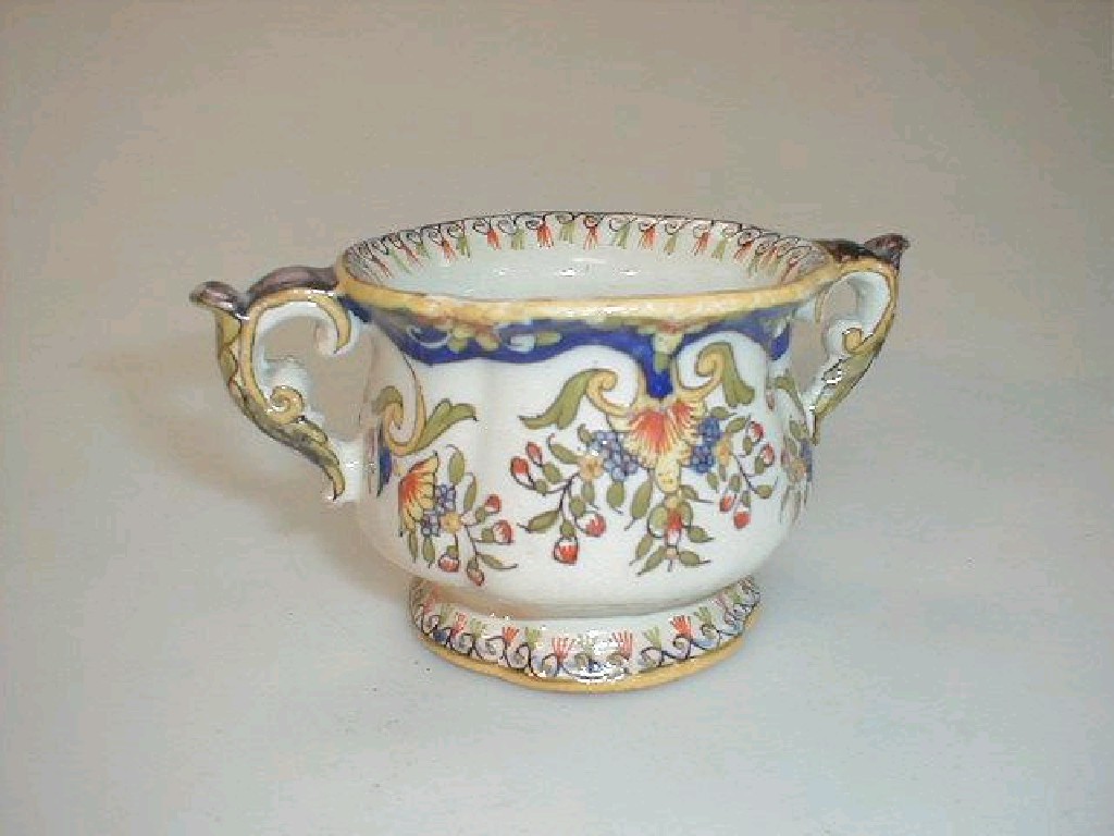 Appraisal: A French Faience two-handled cup probably Aprey Haut Marne of