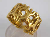 Appraisal: An carat gold pierced band ring approx mm wide size