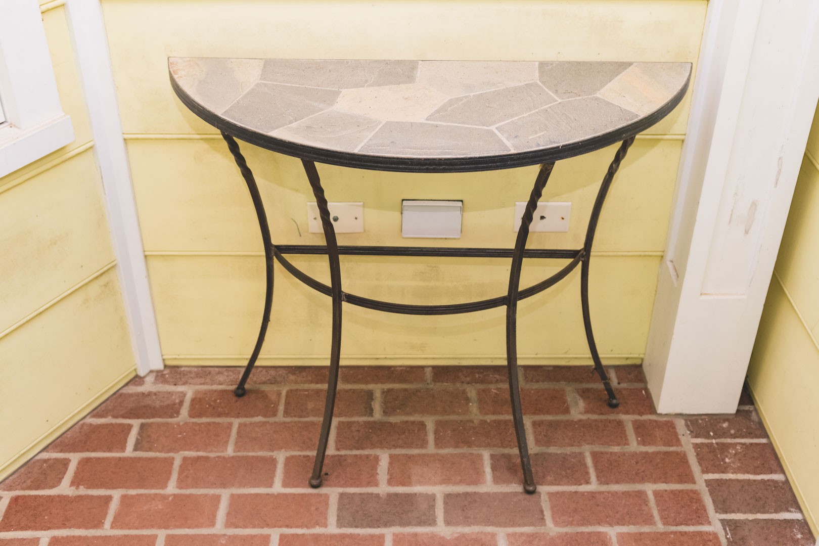 Appraisal: Wrought iron demilune patio table along with a folding corner